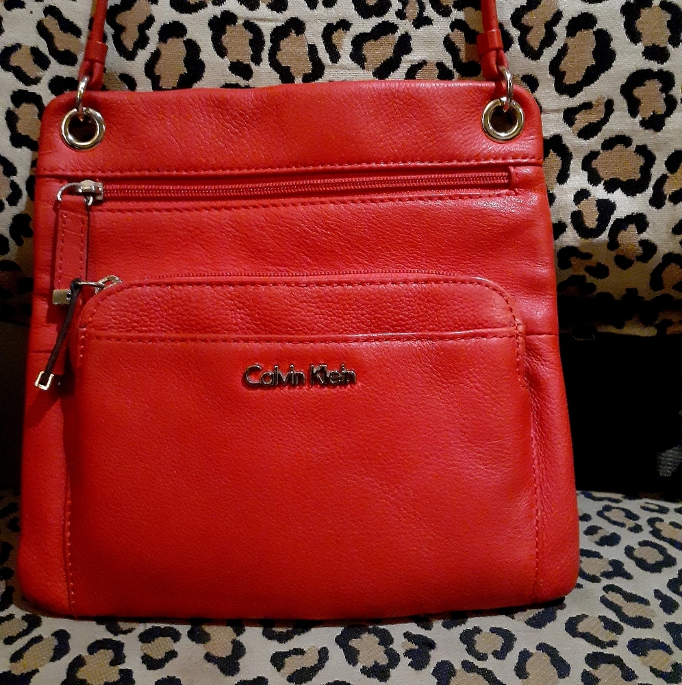 Coral colored Calvin Klein cross body strap purse
